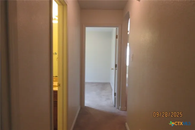 a view of a bathroom with mirror