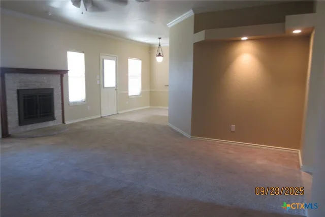 a view of a hallway with windows