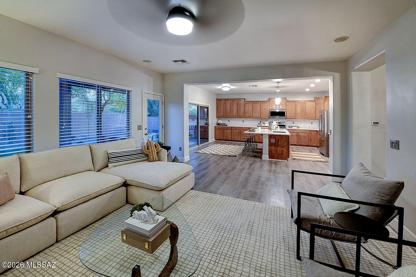 13464 North Piemonte Way Oro Valley, AZ 85755 - Photo 12 of 33 a living room with furniture and a large window