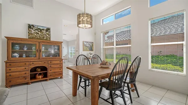a dining room with furniture and window