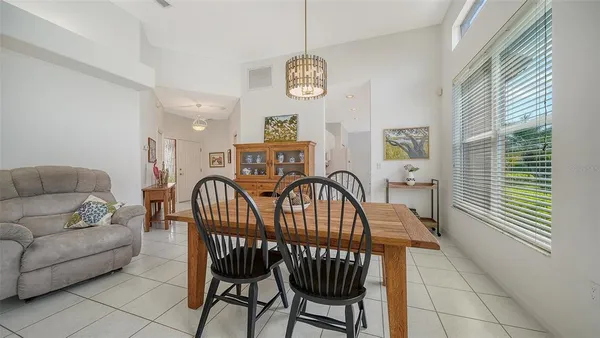 a view of kitchen with granite countertop cabinets