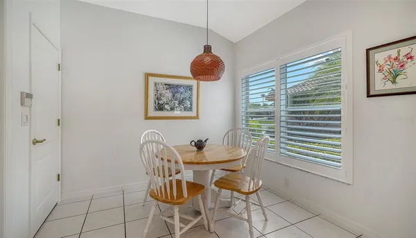 a kitchen with a sink cabinets and window