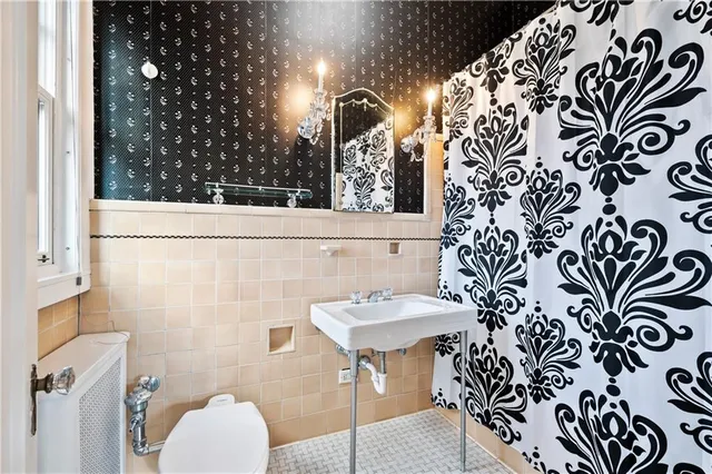 a bathroom with a sink and mirror