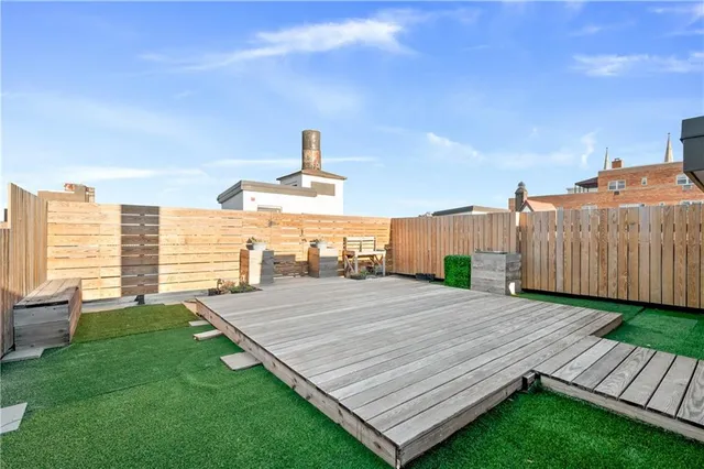 a view of a backyard with a sitting area