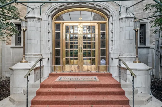 a view of a brick house with a outdoor space