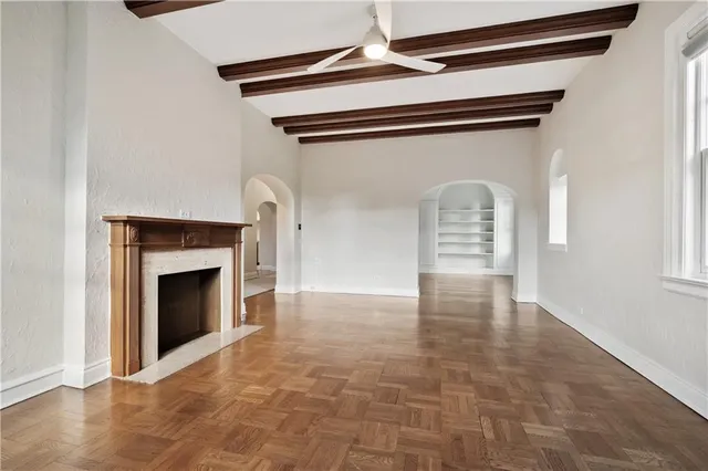 a view of empty room with fireplace
