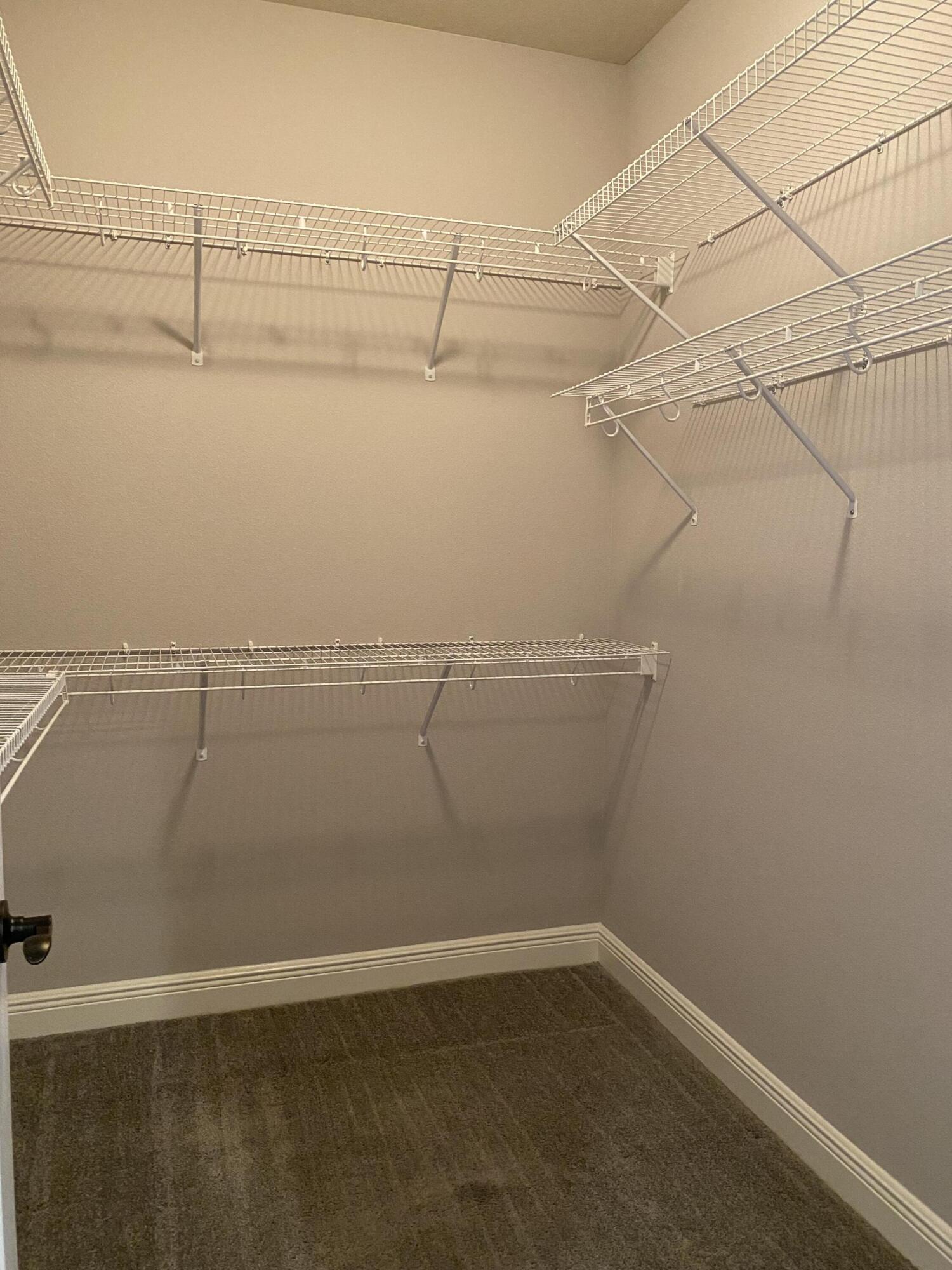 3909 Fielding Court Pace, FL 32571 - Photo 11 of 25 a view of a room with racks on the wall