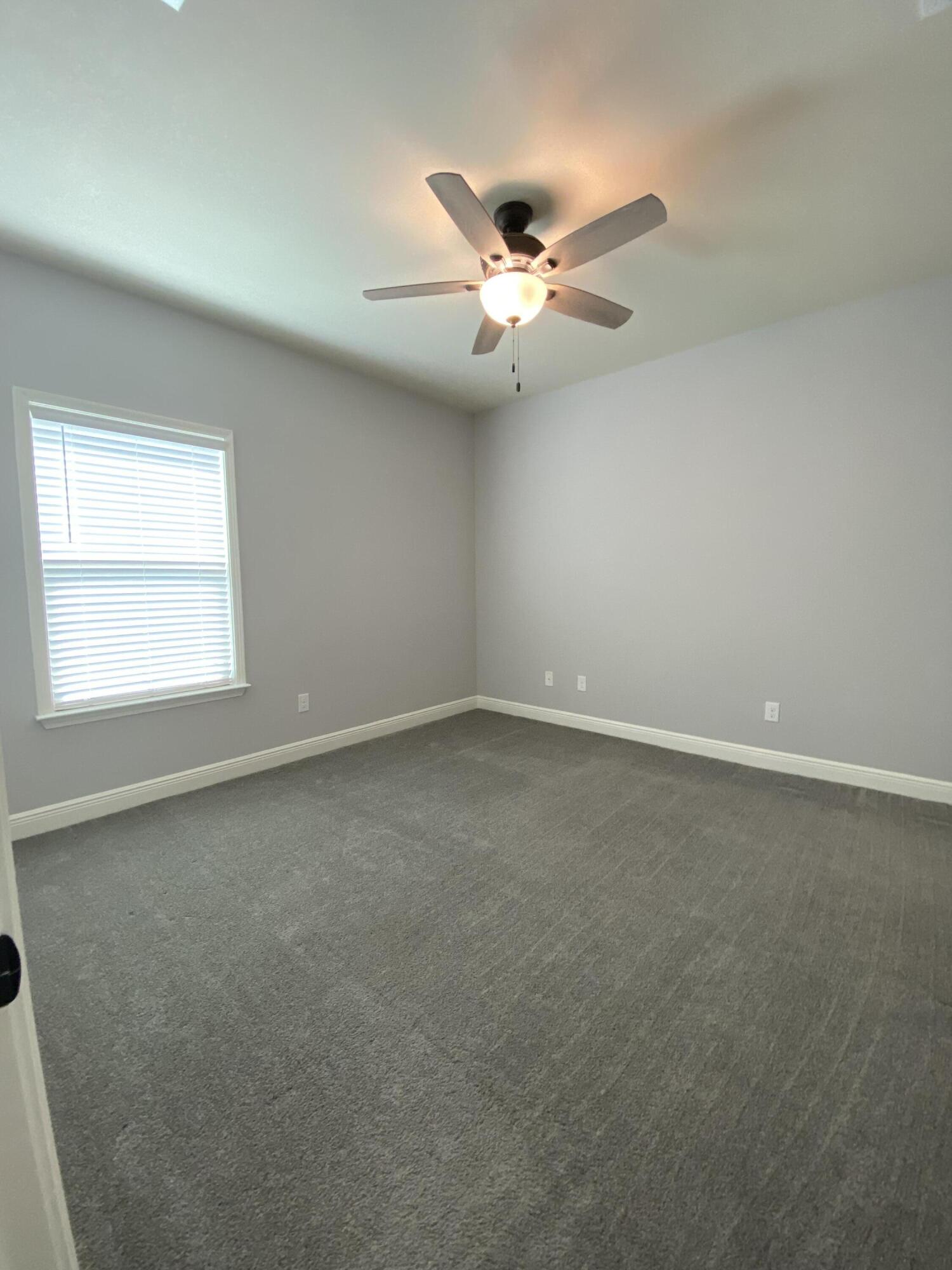 3909 Fielding Court Pace, FL 32571 - Photo 15 of 25 an empty room with a window and a fan