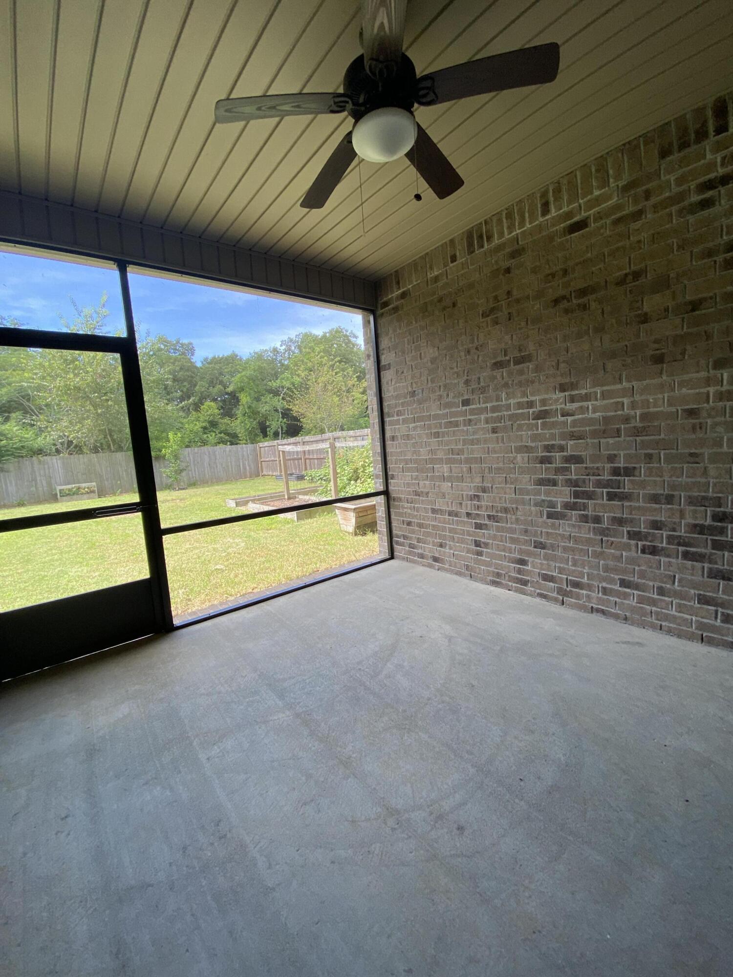 3909 Fielding Court Pace, FL 32571 - Photo 18 of 25 a view of an empty room with a window