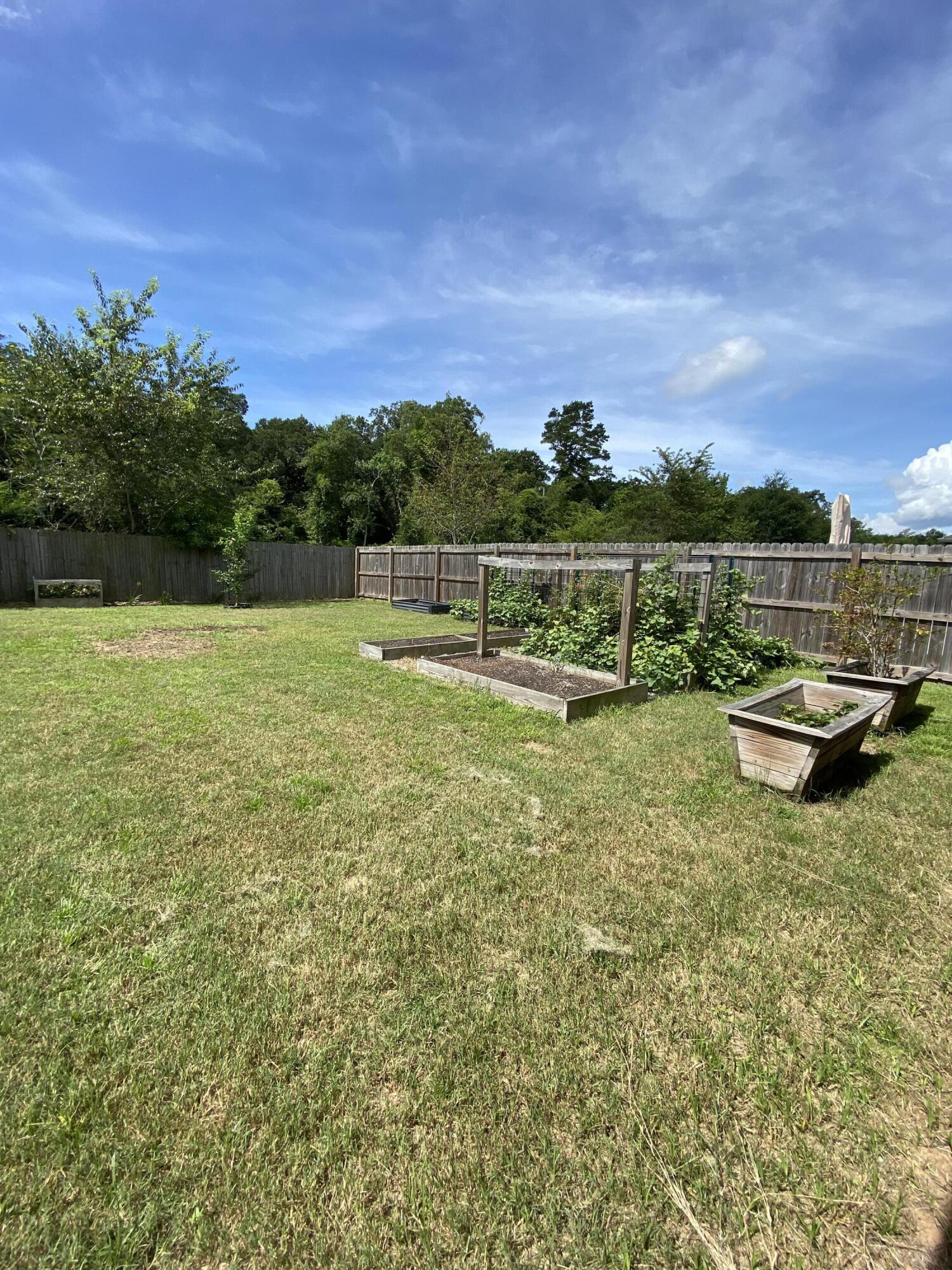 3909 Fielding Court Pace, FL 32571 - Photo 21 of 25 a view of a lake with couches in the back