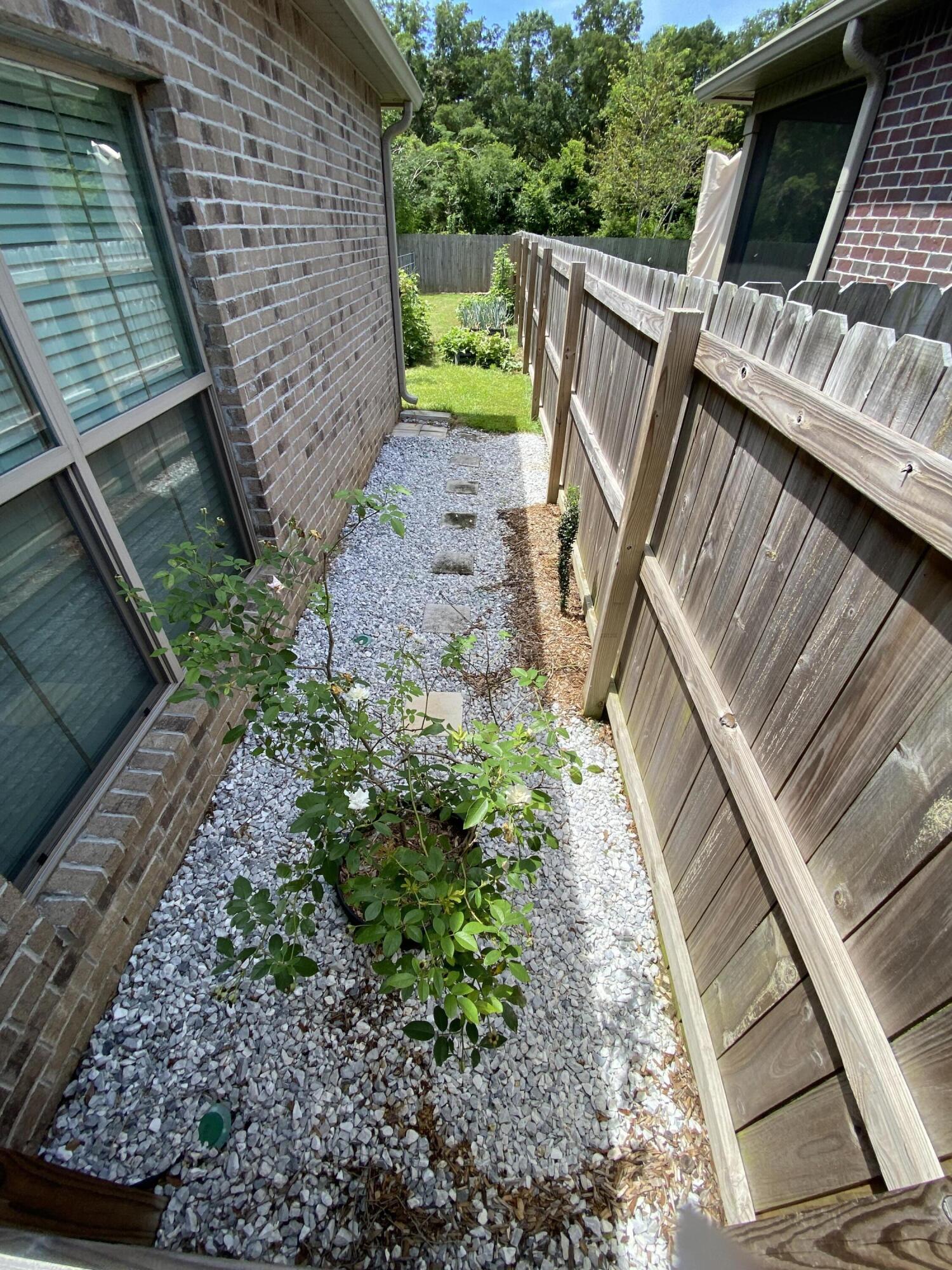 3909 Fielding Court Pace, FL 32571 - Photo 24 of 25 a backyard of a house with lots of green space
