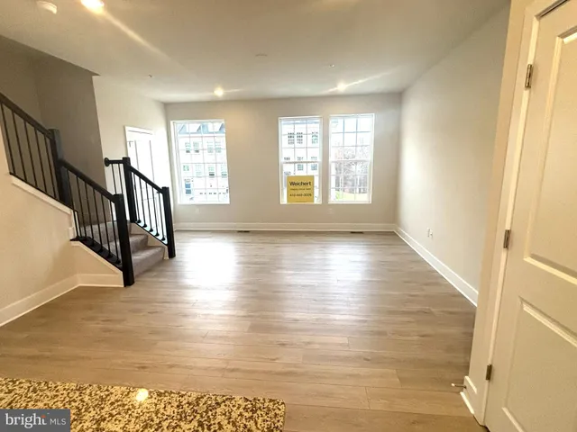a view of an entryway with wooden floor