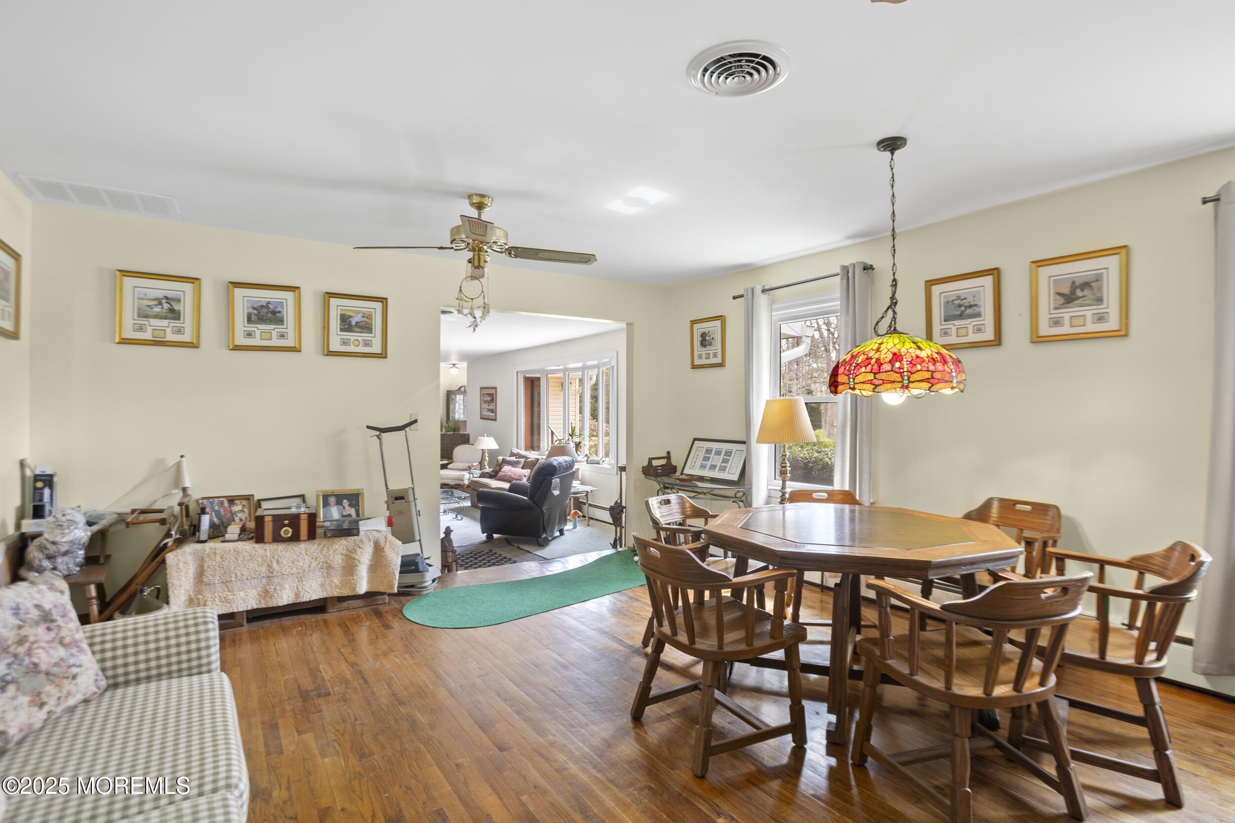 156 Sams Road Jackson, NJ 08527 - Photo 11 of 46 a view of a dining room with furniture wooden floor and chandelier