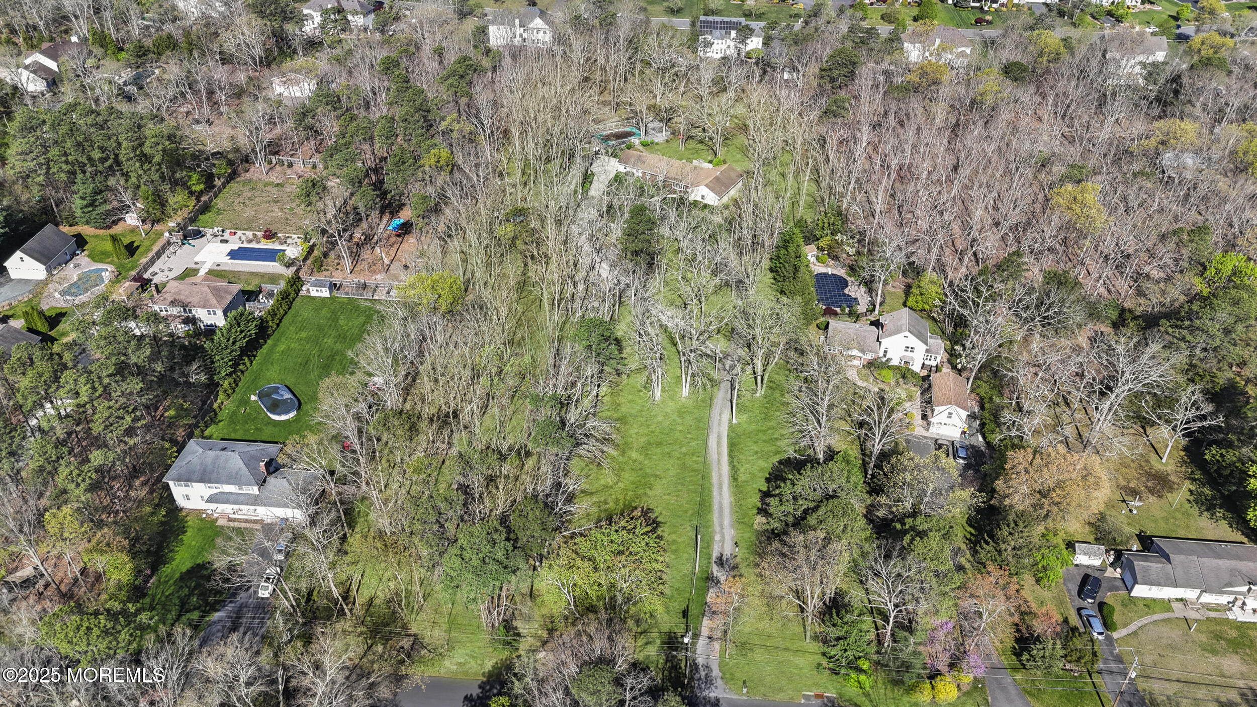 156 Sams Road Jackson, NJ 08527 - Photo 14 of 46 a aerial view of residential house with parking space and trees