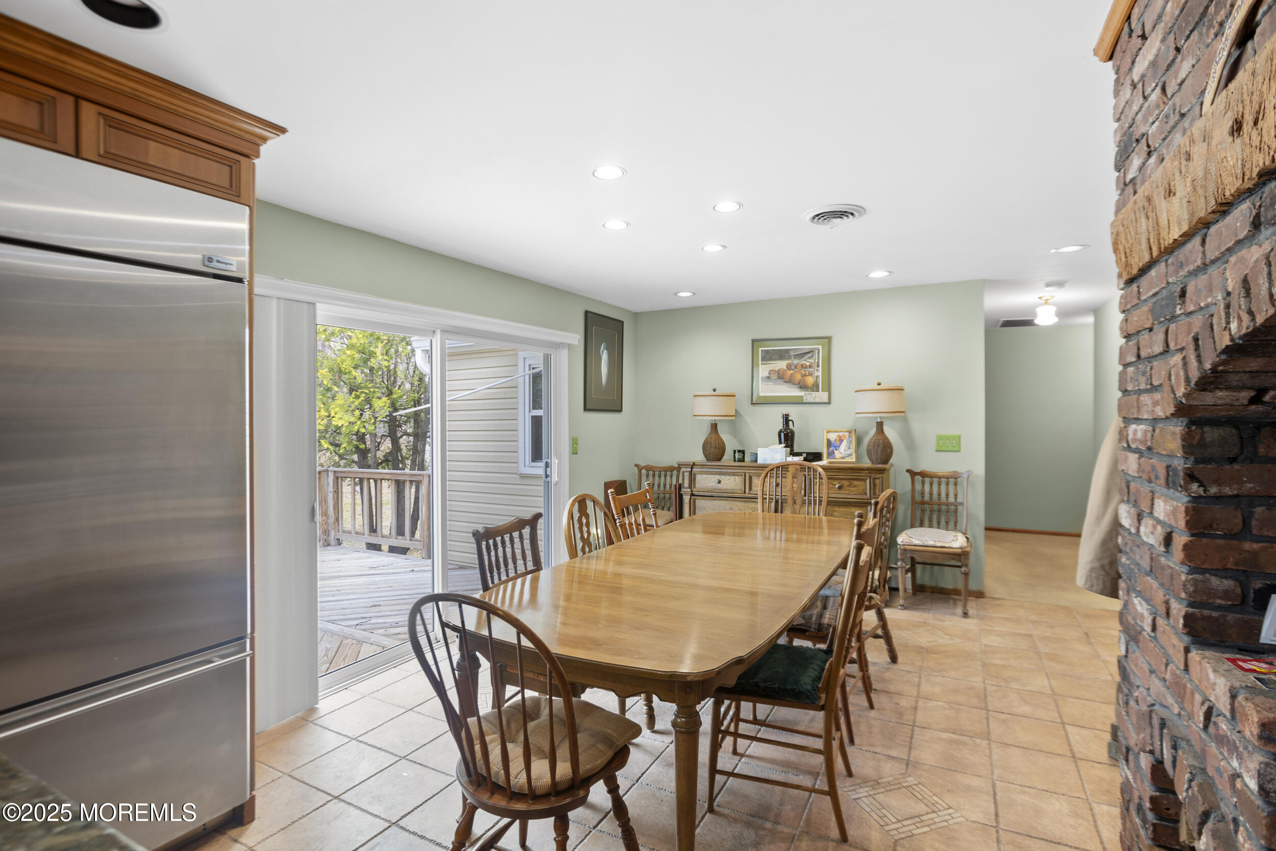 156 Sams Road Jackson, NJ 08527 - Photo 15 of 46 a dining room with furniture and a floor to ceiling window