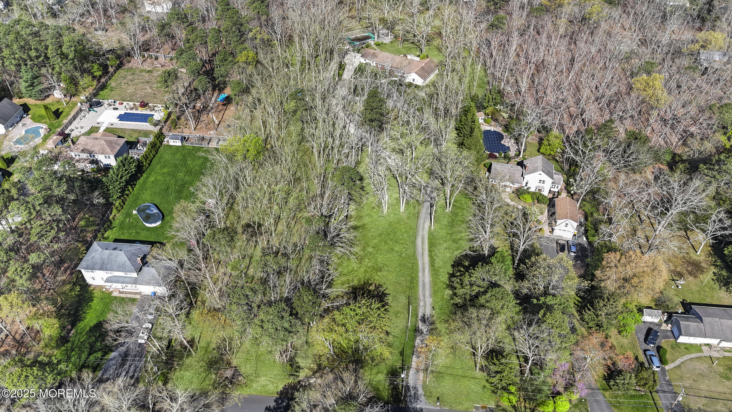 156 Sams Road Jackson, NJ 08527 - Photo 17 of 46 an aerial view of residential house with outdoor space and trees all around
