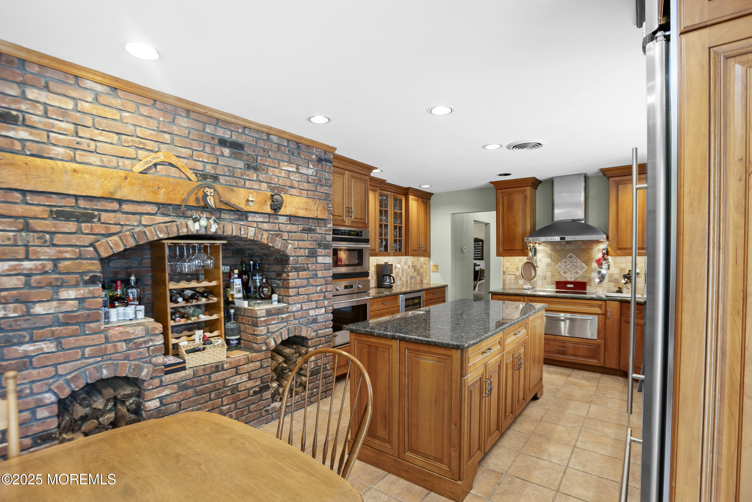 156 Sams Road Jackson, NJ 08527 - Photo 18 of 46 a kitchen with stainless steel appliances kitchen island granite countertop a stove and a sink