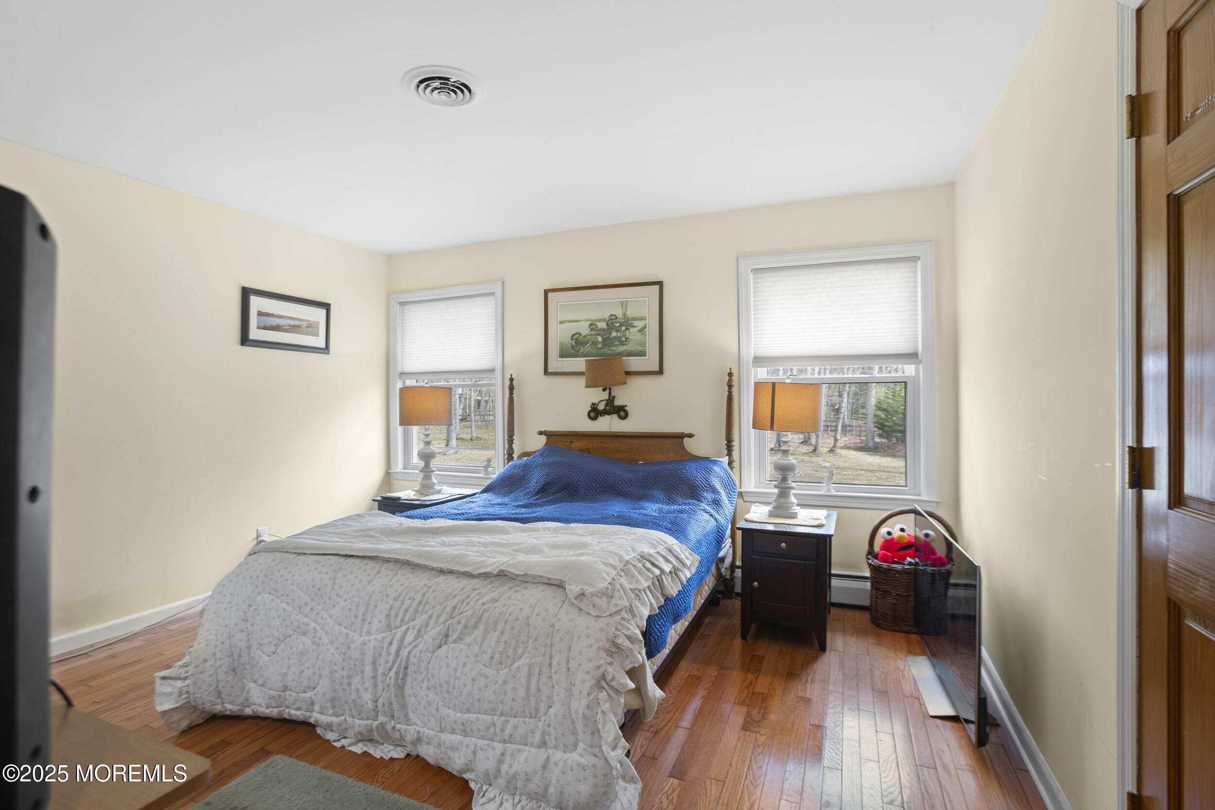 156 Sams Road Jackson, NJ 08527 - Photo 25 of 46 a bedroom with a bed and a chandelier