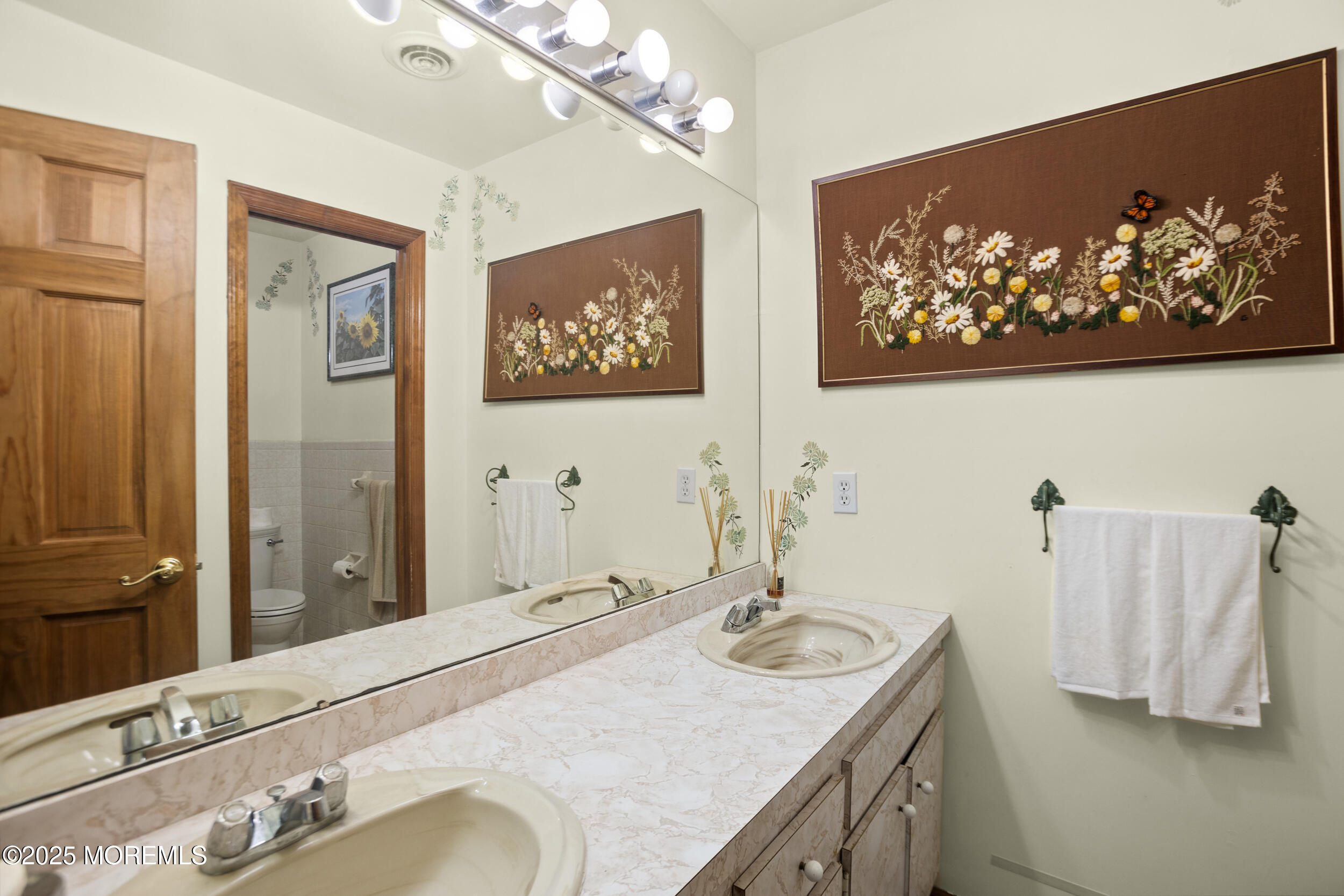 156 Sams Road Jackson, NJ 08527 - Photo 28 of 46 a bathroom with a sink and a mirror