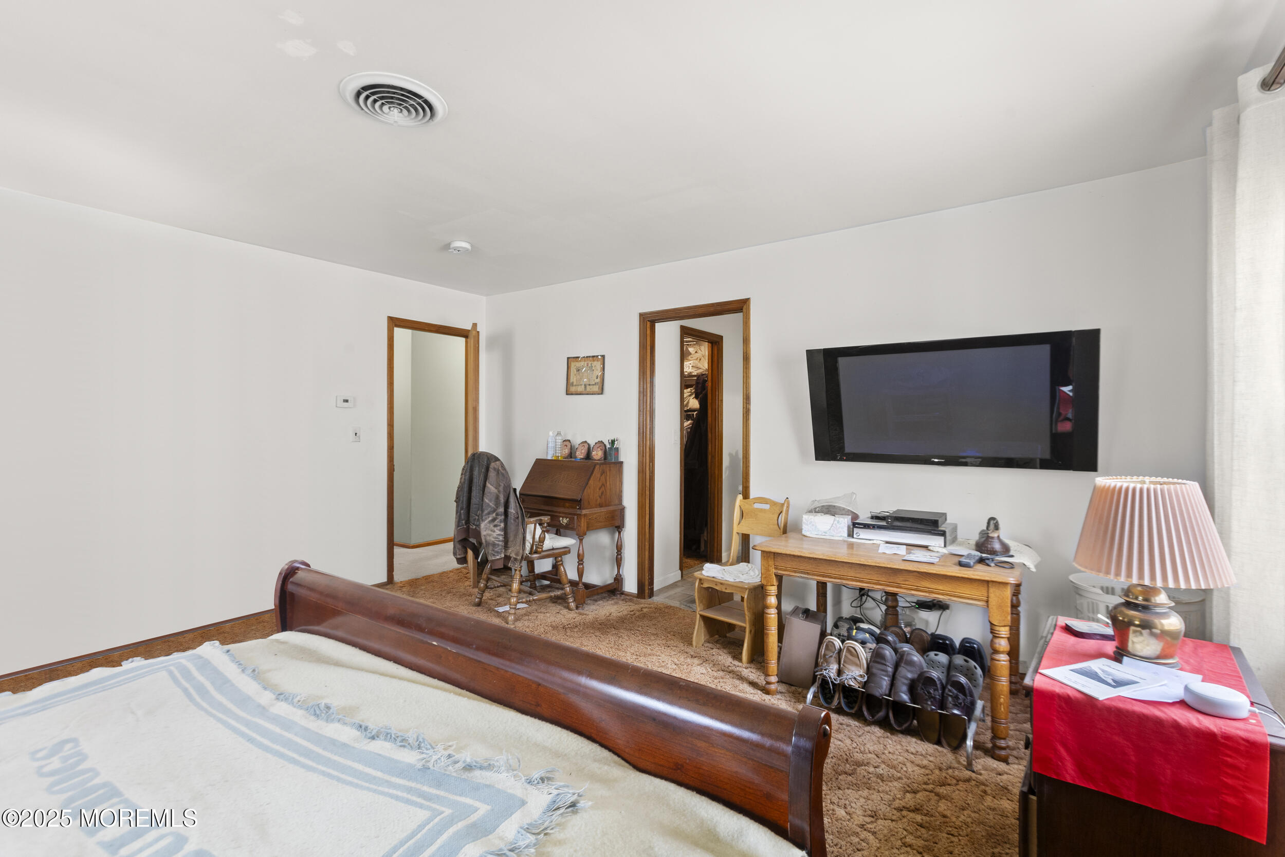 156 Sams Road Jackson, NJ 08527 - Photo 31 of 46 a bedroom with a bed and flat screen tv