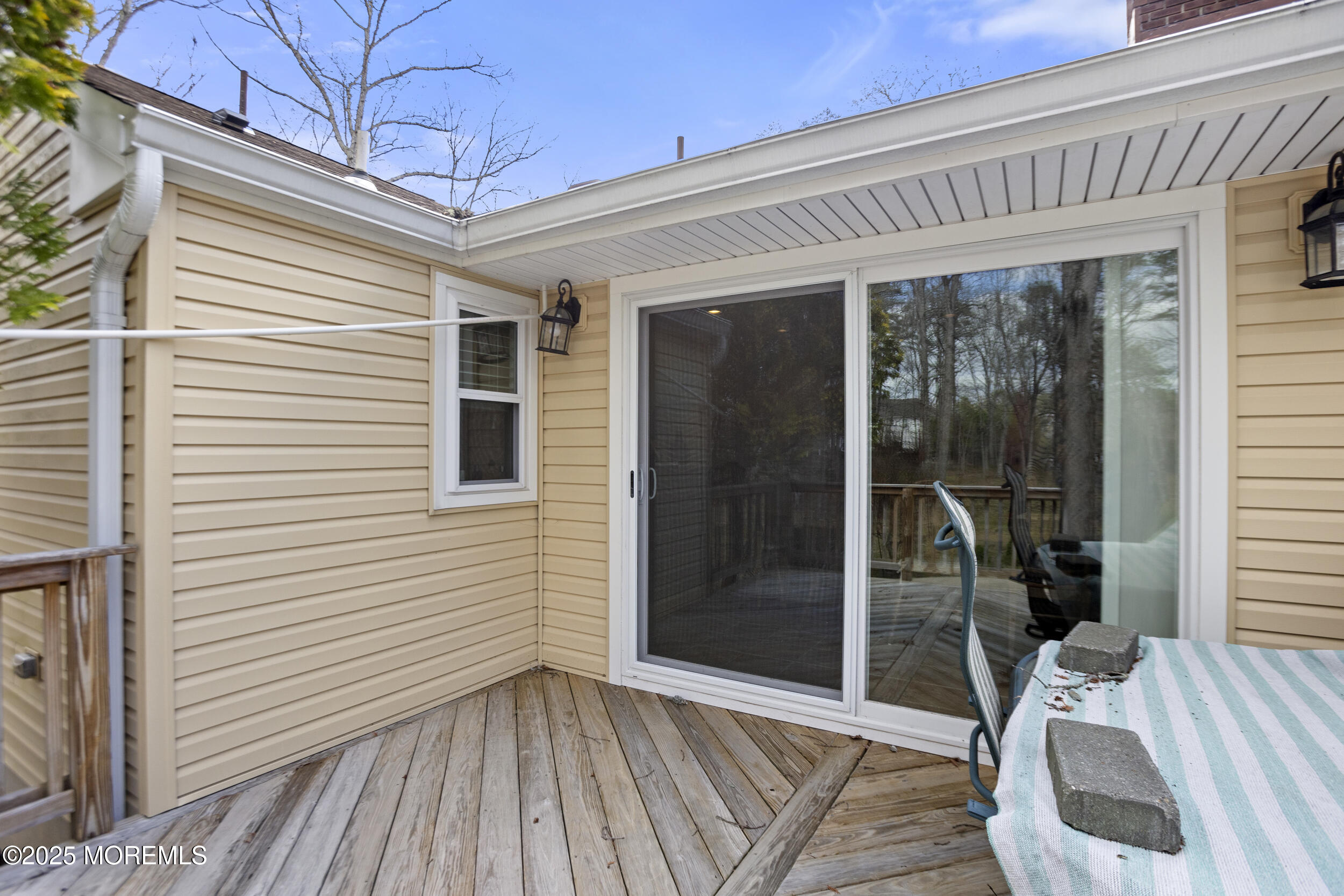 156 Sams Road Jackson, NJ 08527 - Photo 35 of 46 a view of a porch with wooden floor and iron stairs
