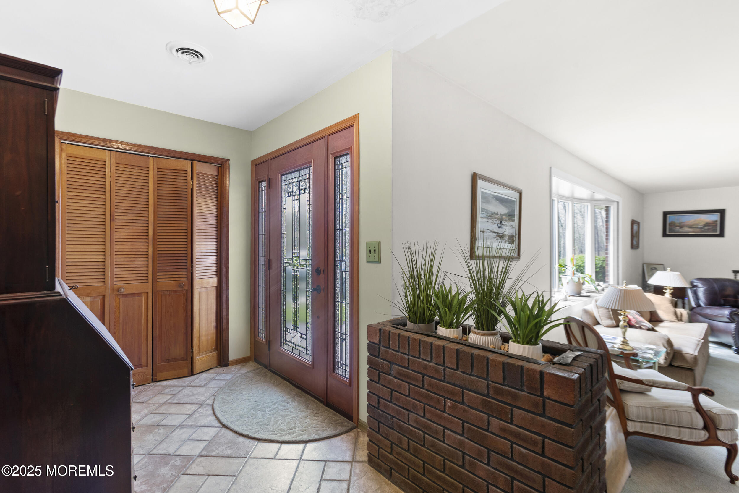 156 Sams Road Jackson, NJ 08527 - Photo 6 of 46 a living room with furniture potted plant and a window