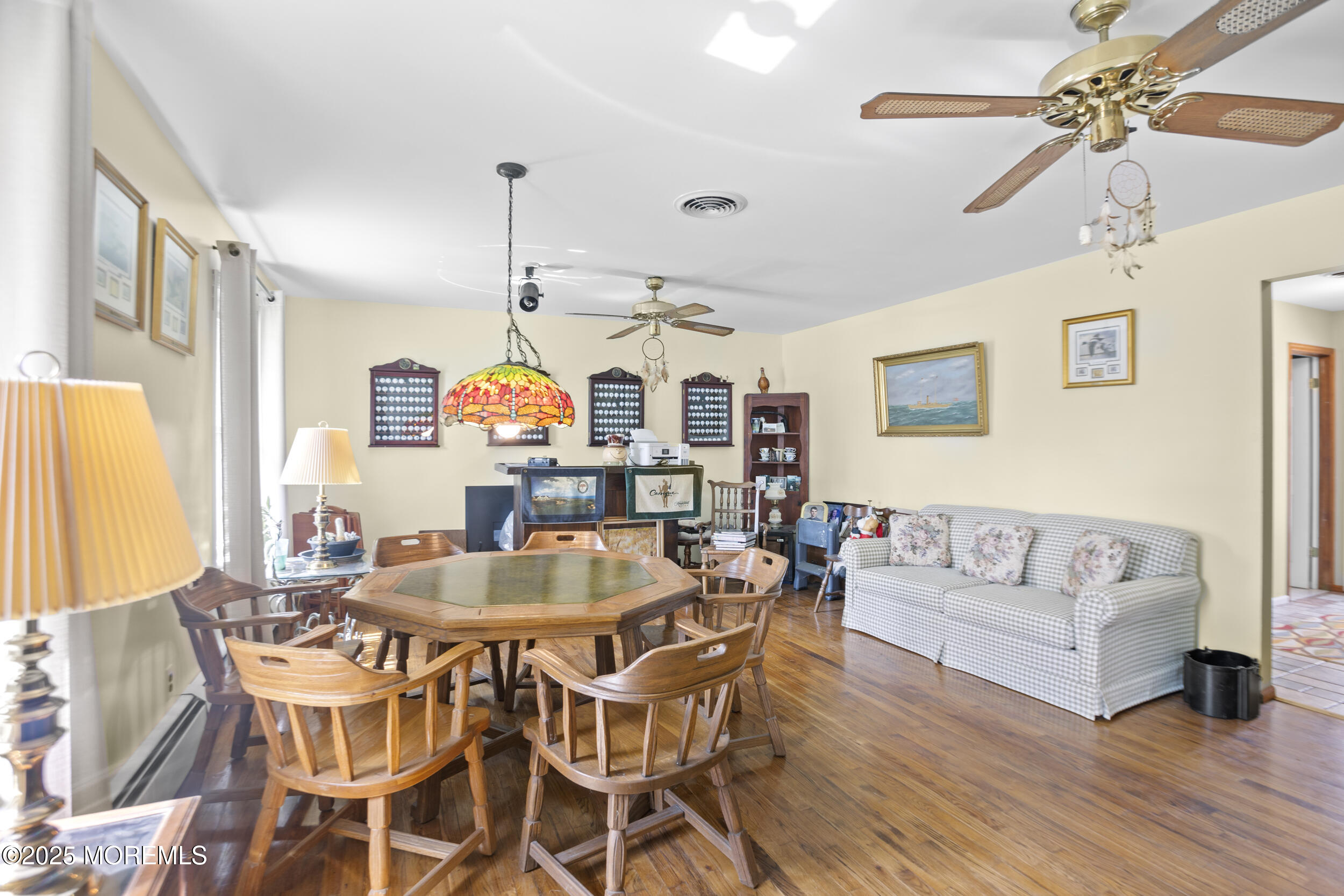 156 Sams Road Jackson, NJ 08527 - Photo 10 of 46 a view of a dining room with furniture window and wooden floor