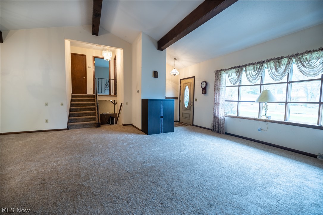 7961 Bellflower Road Mentor, OH 44060 - Photo 10 of 32 Spacious living room with stairs leading to the upstairs bedrooms and finished lower level