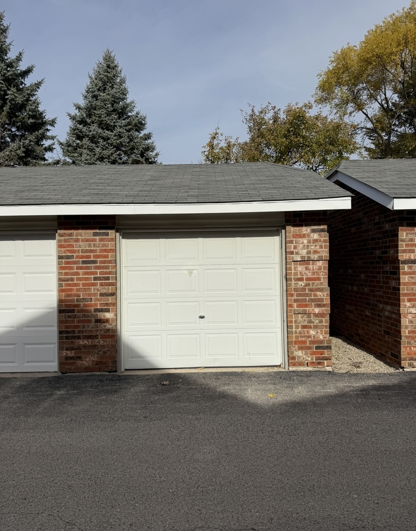 4304 West Shamrock Lane, Unit 1A McHenry, IL 60050 - Photo 17 of 20 a view of a house with a garage