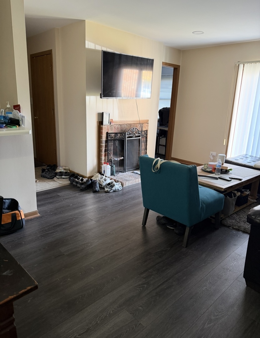 4304 West Shamrock Lane, Unit 1A McHenry, IL 60050 - Photo 8 of 20 a living room with furniture and a flat screen tv