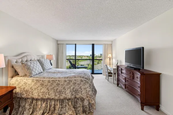 a balcony with furniture and city view