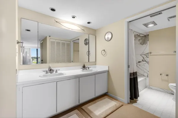 a view of a swimming pool with a table and chairs