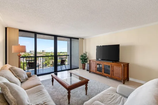 a kitchen with white cabinets sink and stainless steel appliances