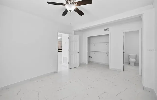 an empty room with a bathroom