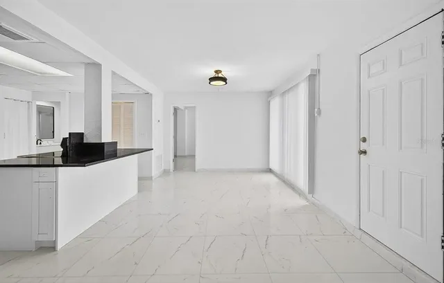 a view of a kitchen with a sink