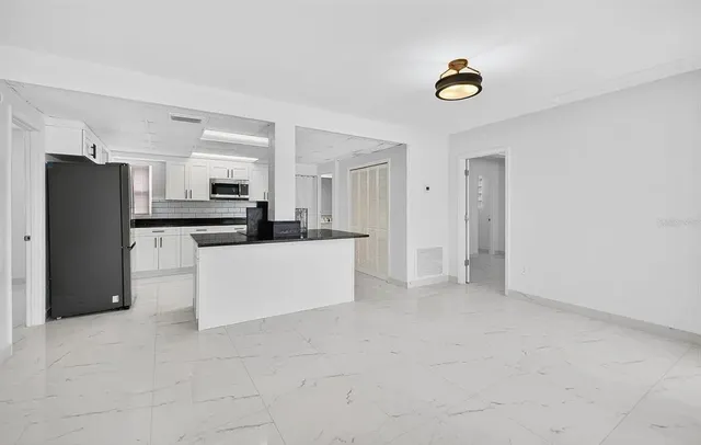 a view of a kitchen with a sink