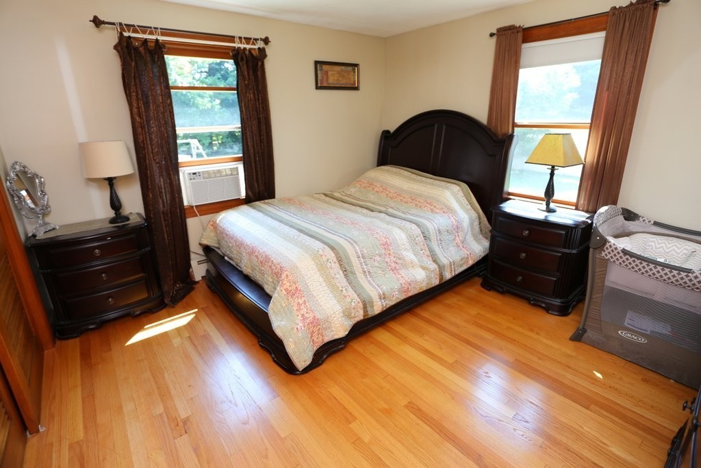 14 Fairview Road Wilbraham, MA 01095 - Photo 13 of 30 a bedroom with a bed window and mirror