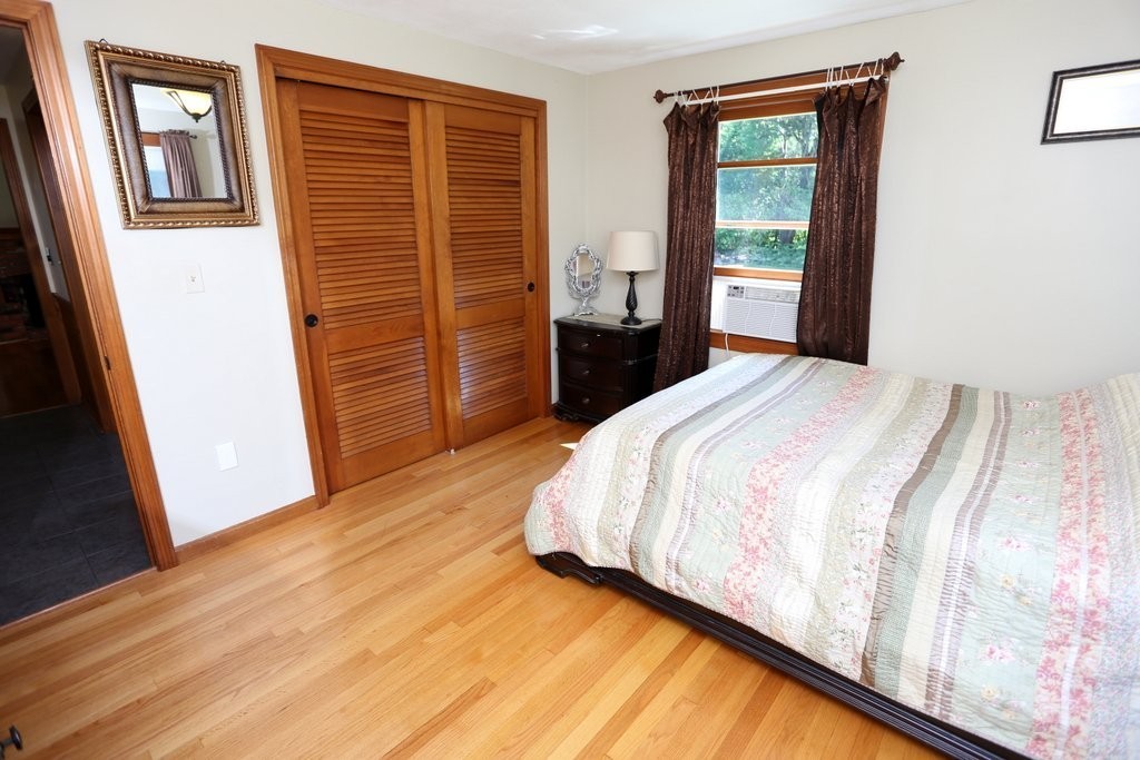 14 Fairview Road Wilbraham, MA 01095 - Photo 14 of 30 a bedroom with a bed and wooden floor