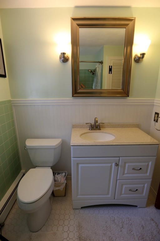 14 Fairview Road Wilbraham, MA 01095 - Photo 16 of 30 a bathroom with a toilet a sink and mirror