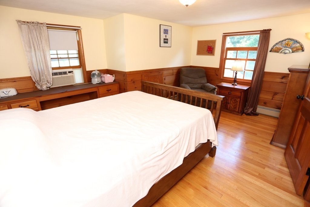 14 Fairview Road Wilbraham, MA 01095 - Photo 23 of 30 a spacious bedroom with a bed and wooden floor