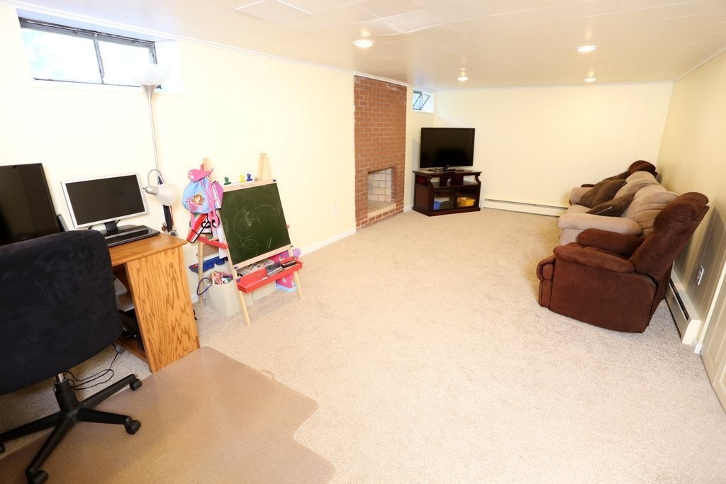 14 Fairview Road Wilbraham, MA 01095 - Photo 24 of 30 a living room with furniture and a flat screen tv