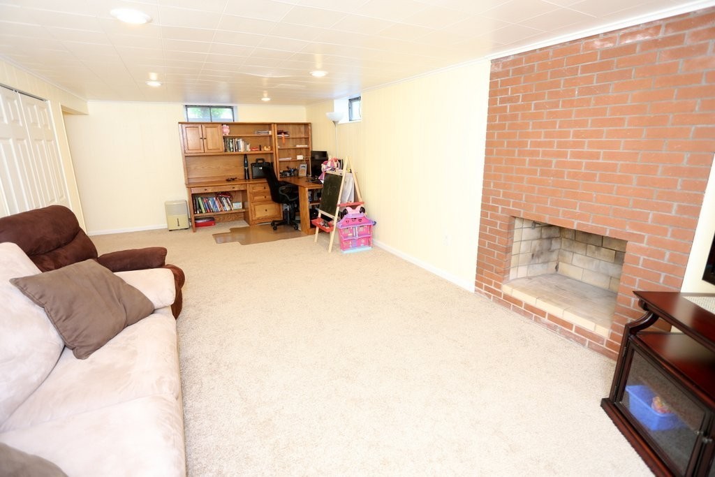 14 Fairview Road Wilbraham, MA 01095 - Photo 25 of 30 a living room with furniture and a fireplace