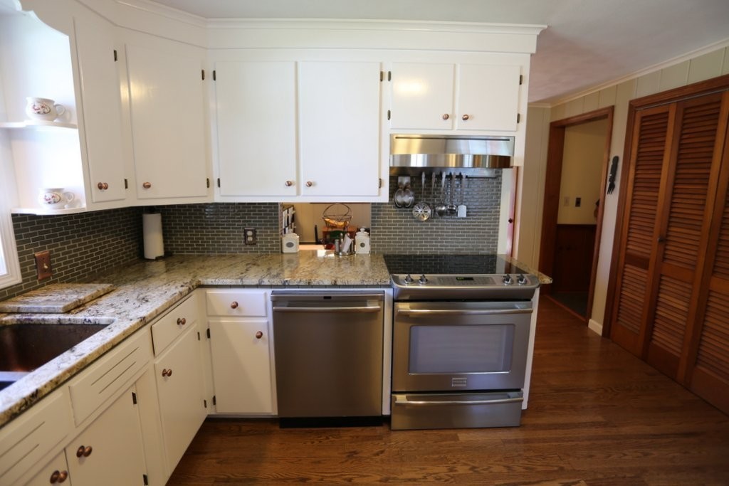 14 Fairview Road Wilbraham, MA 01095 - Photo 8 of 30 a kitchen with stainless steel appliances granite countertop a stove a sink and a refrigerator