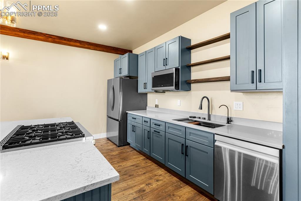 332 Yellow Bird Road Rye, CO 81069 - Photo 12 of 49 a kitchen with stainless steel appliances granite countertop a sink stove and refrigerator