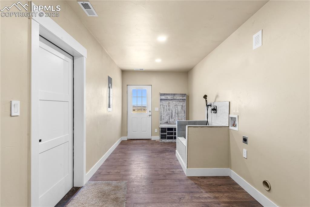 332 Yellow Bird Road Rye, CO 81069 - Photo 21 of 49 a view of a kitchen with a sink refrigerator and wooden floor