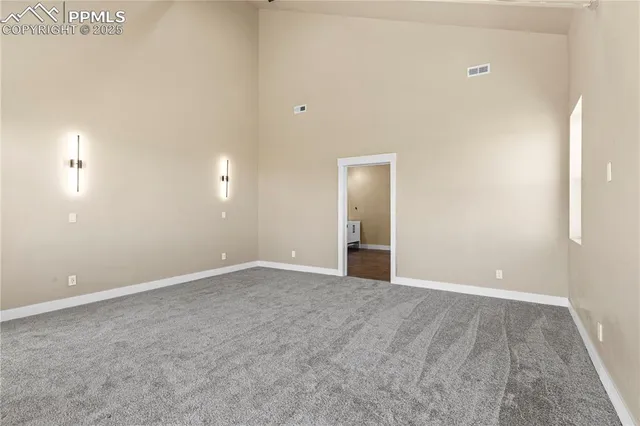 an empty room with closet and a bathroom
