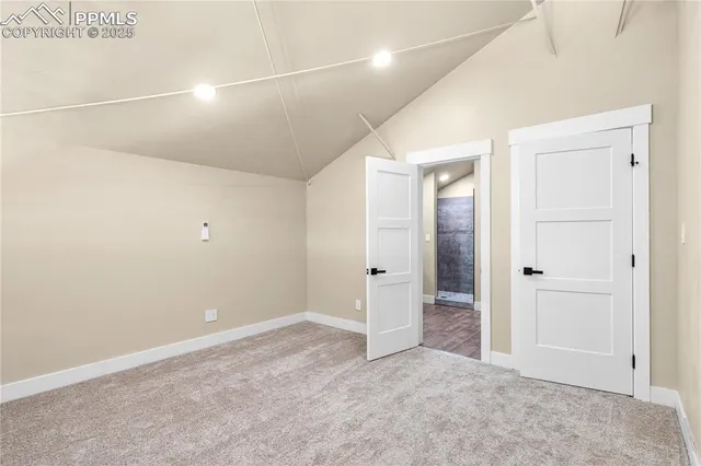 a bathroom with a toilet a sink and glass door