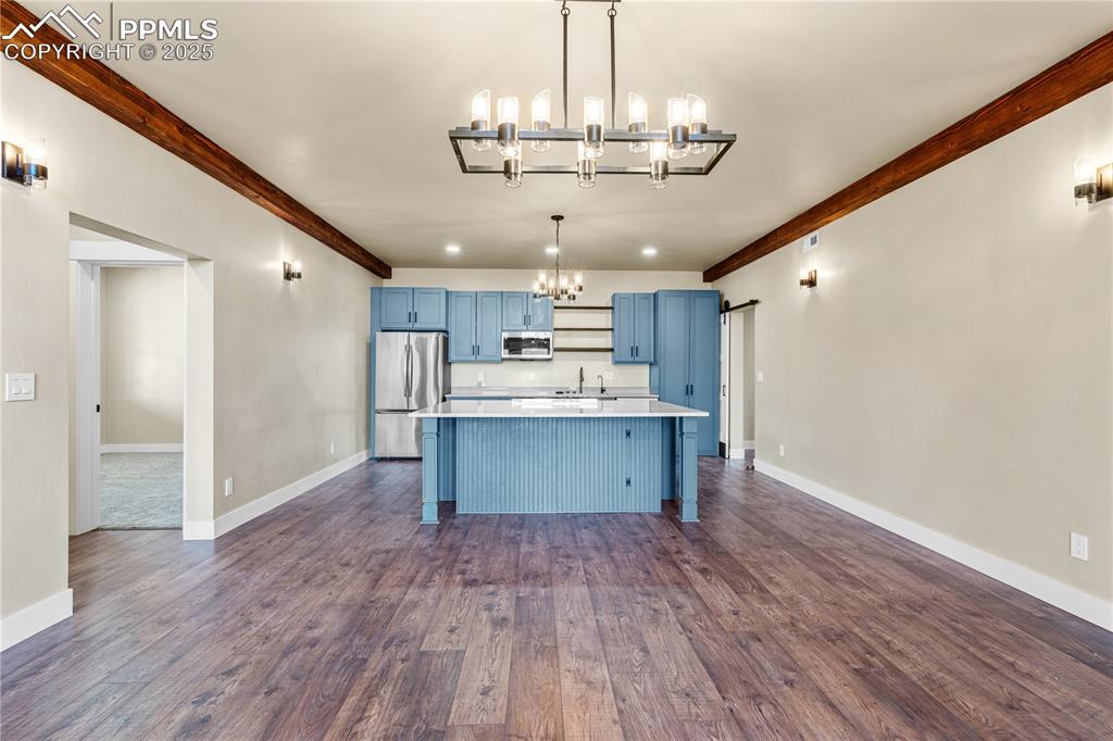 332 Yellow Bird Road Rye, CO 81069 - Photo 7 of 49 a view of a kitchen with a sink dishwasher wooden floor and cabinets