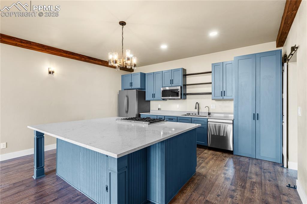 332 Yellow Bird Road Rye, CO 81069 - Photo 8 of 49 a kitchen with kitchen island a sink counter top space cabinets and stainless steel appliances