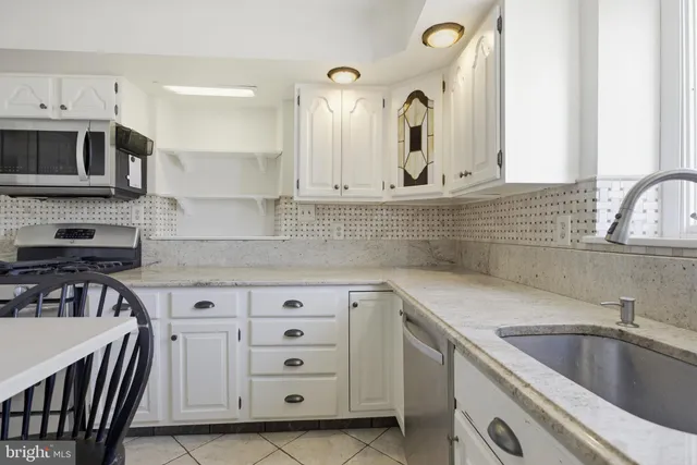 a bedroom with a bed and a table